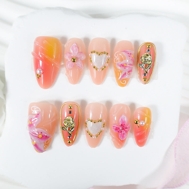 Artificial nail set with delicate flower designs and glamorous accents Stornfield