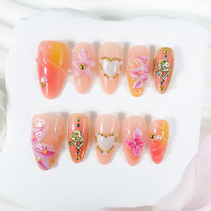 Artificial nail set with delicate flower designs and glamorous accents Stornfield