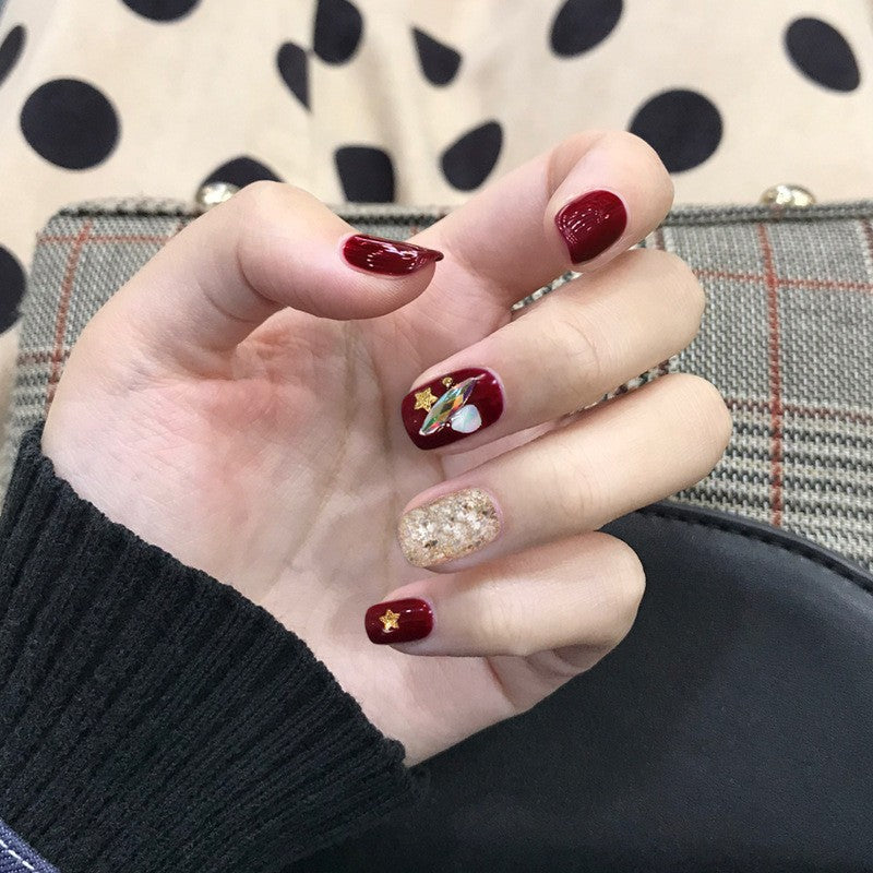 Artful nail extensions with an elegant leaf pattern Stornfield
