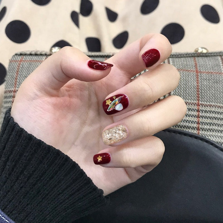 Artful nail extensions with an elegant leaf pattern Stornfield