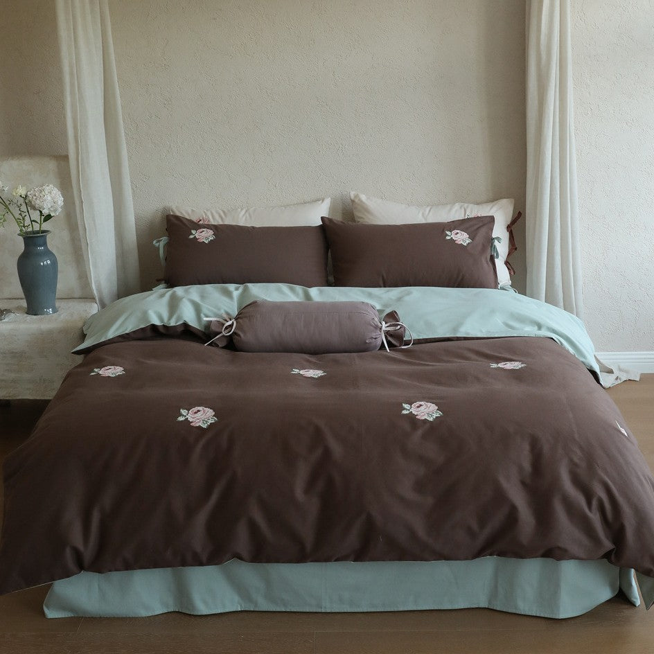 Reversible cotton bedding set with rose embroidery and decorative roll