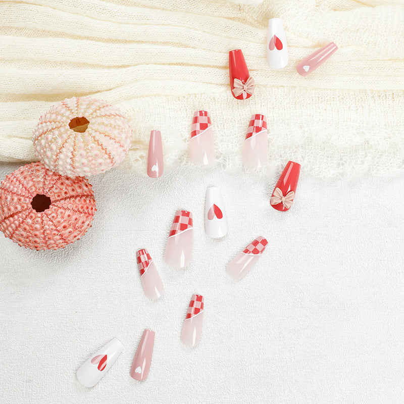 Artful nail extensions with playful designs and romantic accents Stornfield