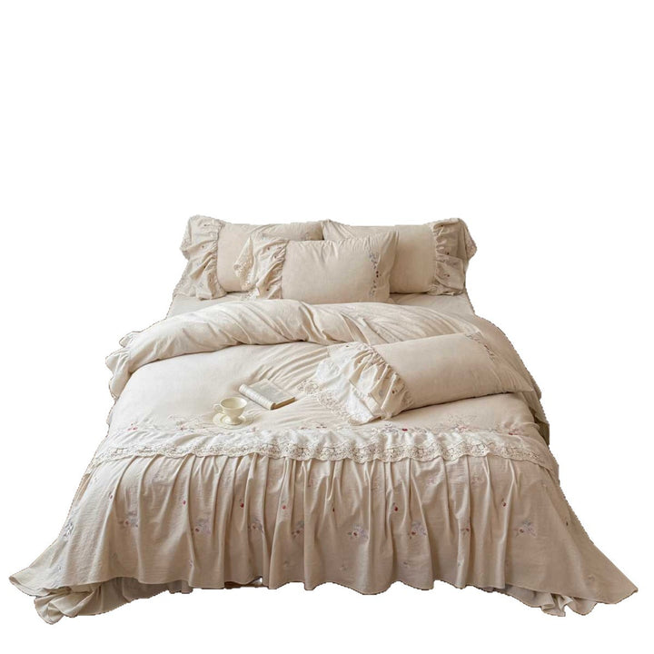 Country house style complete bedding set with voluminous bed skirt, lace trim, and fine floral embroidery