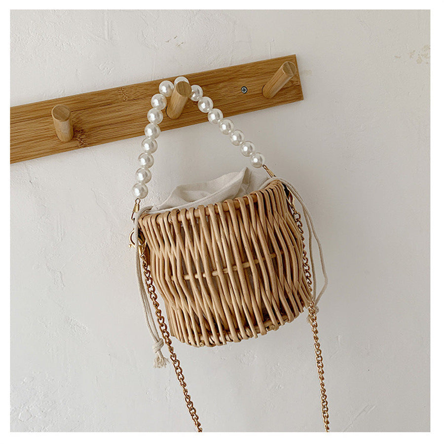 Women’s handbag with elegant pearl handle and braided design Stornfield