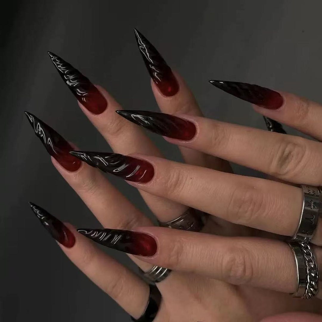 Gothic-style artificial nails with pointed tips and shiny surface Stornfield