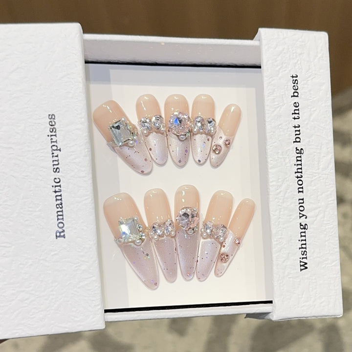 Romantic artificial nails with glitter decoration Stornfield