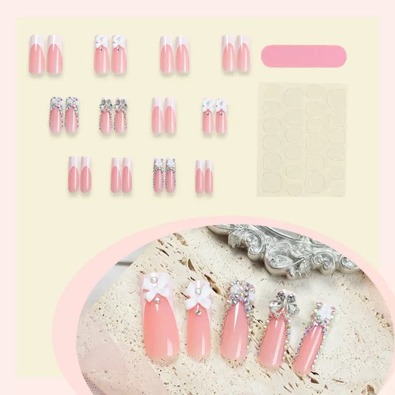 Artificial nail set with shimmering rhinestone decorations and floral design Stornfield