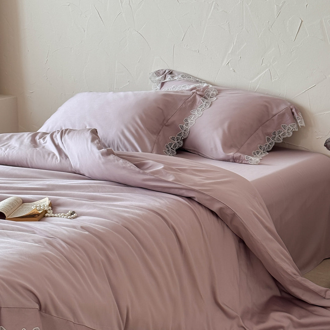 Satin bedding set with silky-smooth texture and floral lace trim