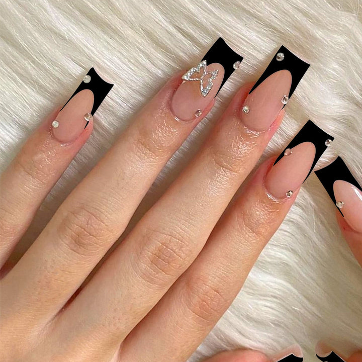 Acrylic nail set with elegant rhinestone details and modern designs Stornfield