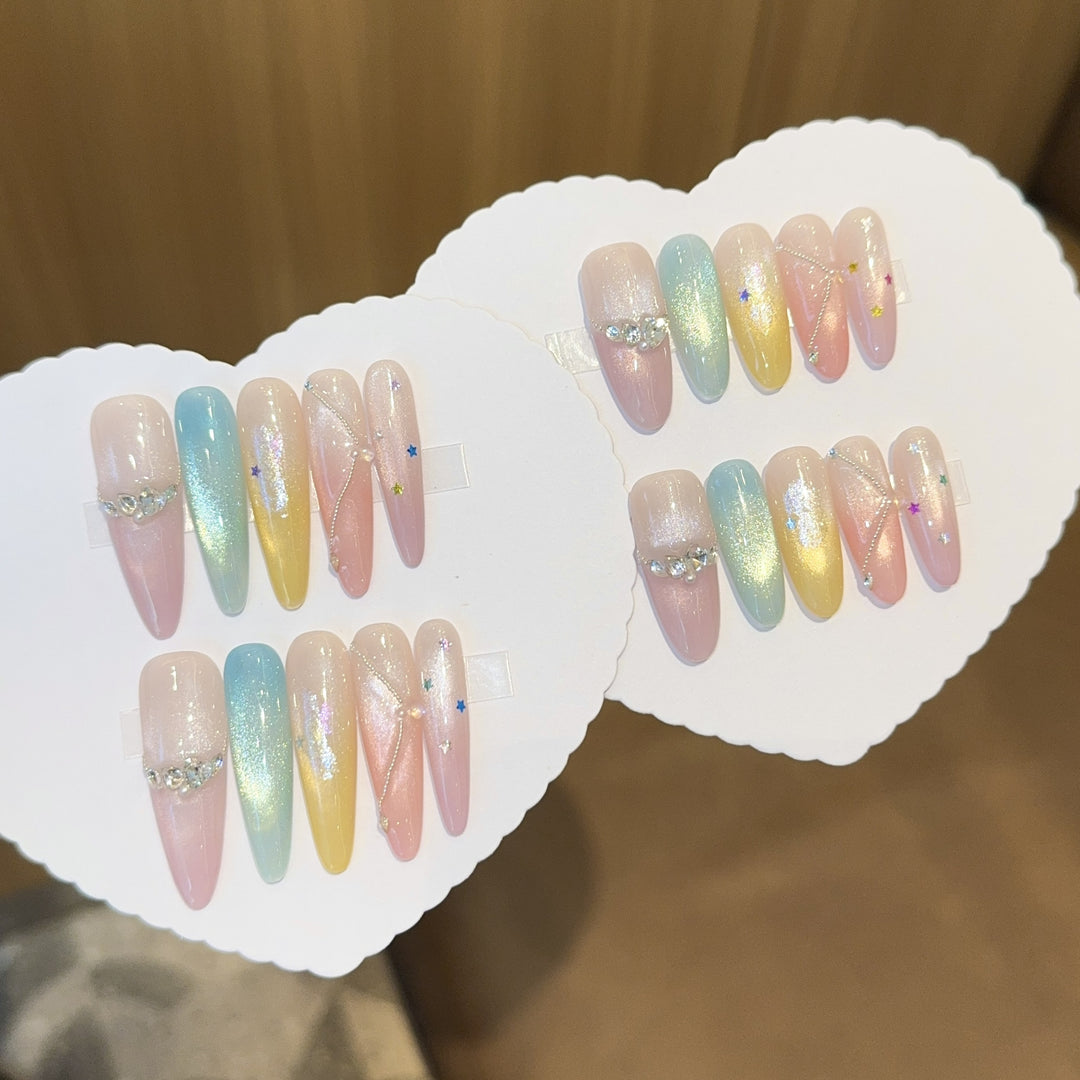 Artificial nails with shimmering effects and sparkling rhinestone details Stornfield