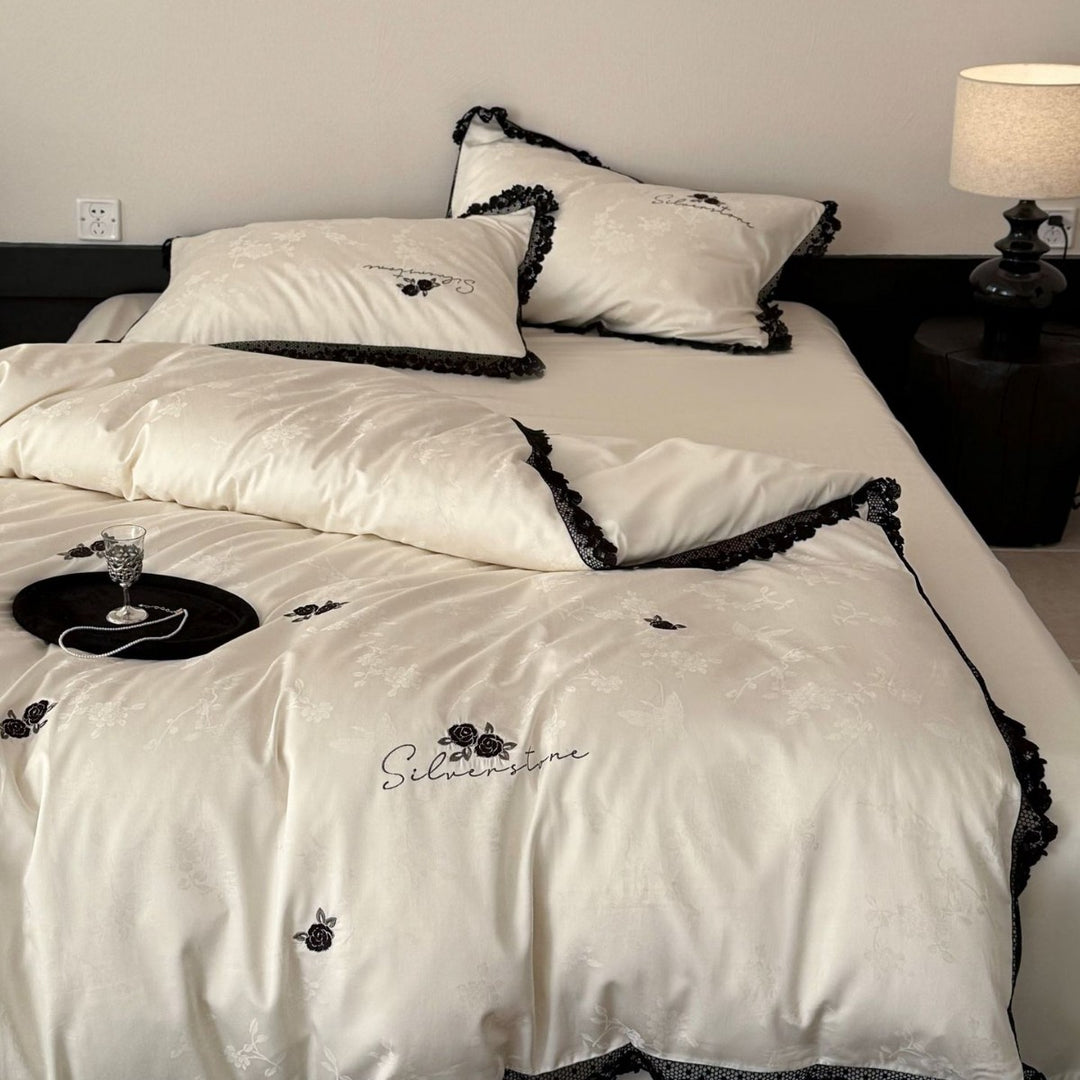 Luxurious cotton satin bedding set with lace border and rose embroidery