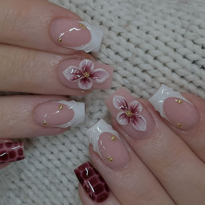Artificial nail set with luxurious 3D flower accents and glitter details Stornfield