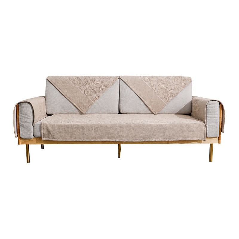 Quilted cover for sofa with armrest protectors and non-slip underside