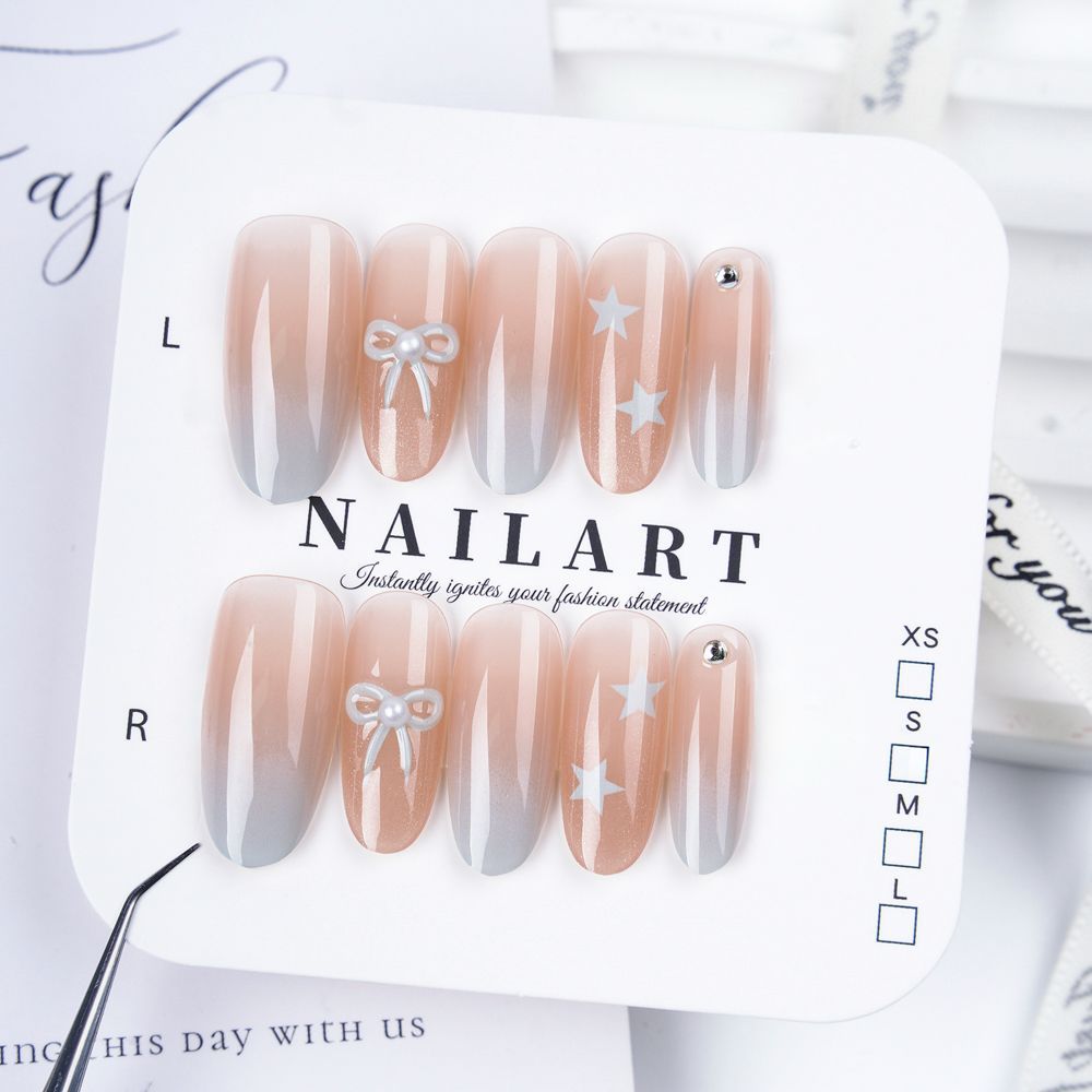 Artificial nails with elegant ombre effect and decorative accents Stornfield