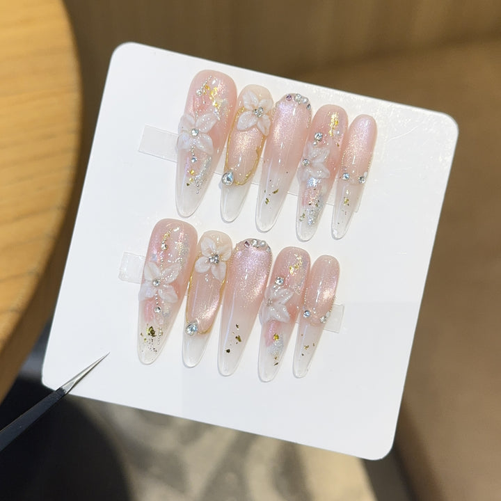 Art nails with filigree floral designs Stornfield