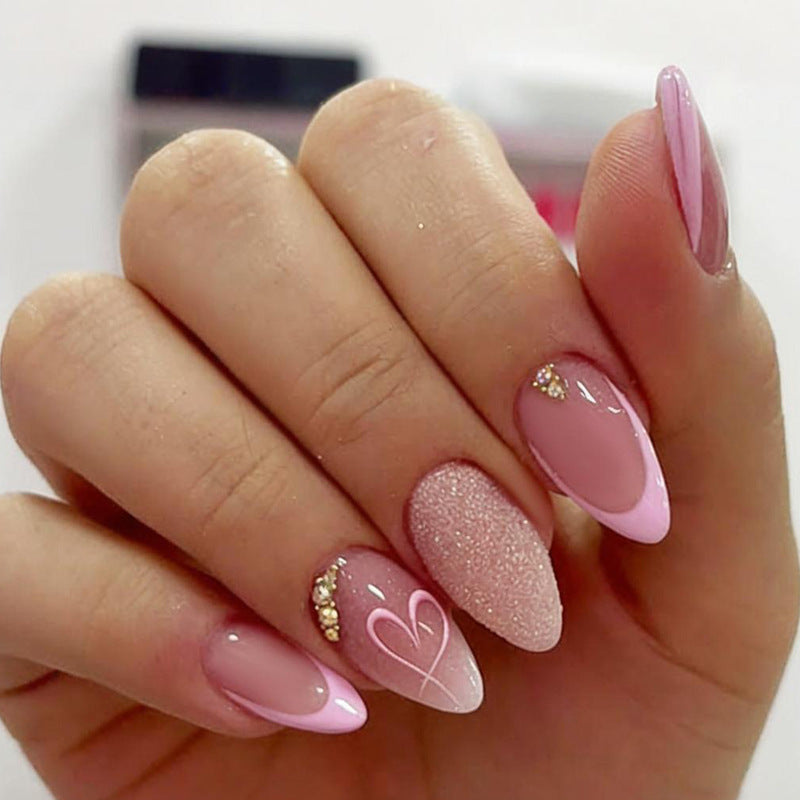 Artificial nail set with delicate glitter and heart designs Stornfield