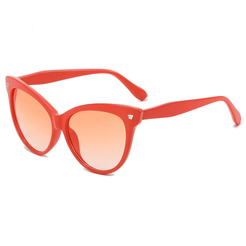 Ladies trendy cat-eye sunglasses with transparent frame and blue lenses Stornfield