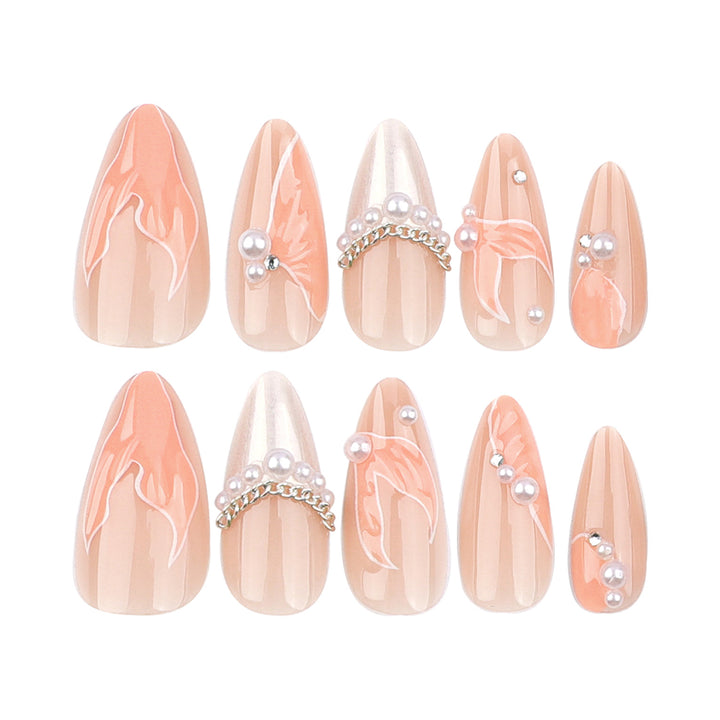 Artistic stiletto nails with pearl and flower embellishments Stornfield