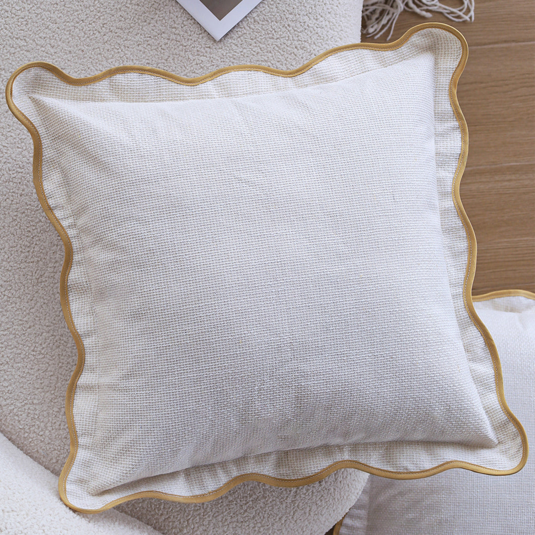 Square cushion cover made of cotton-linen with raised diamond tufting and corner tassels Stornfield