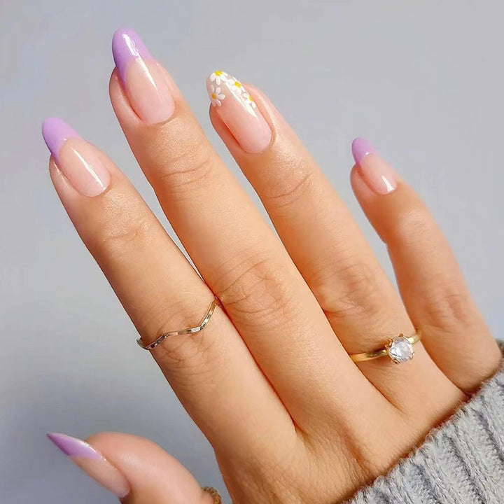 Artful nail extensions with an elegant leaf pattern Stornfield