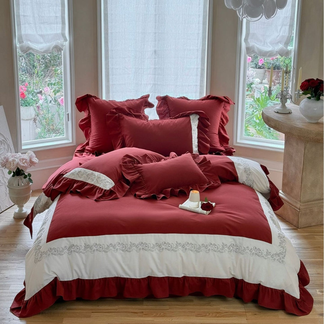 Designer bed linen set with ruffle hem and fine border embroidery