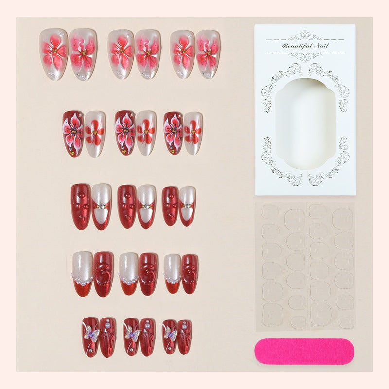 Artificial nail set with floral designs and glamorous accents Stornfield
