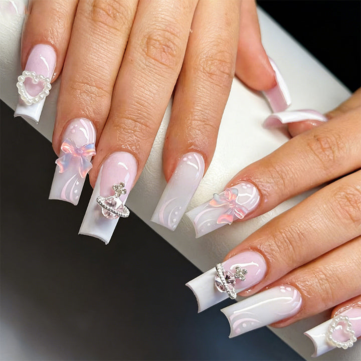 Artificial nails with delicate embellishments Stornfield