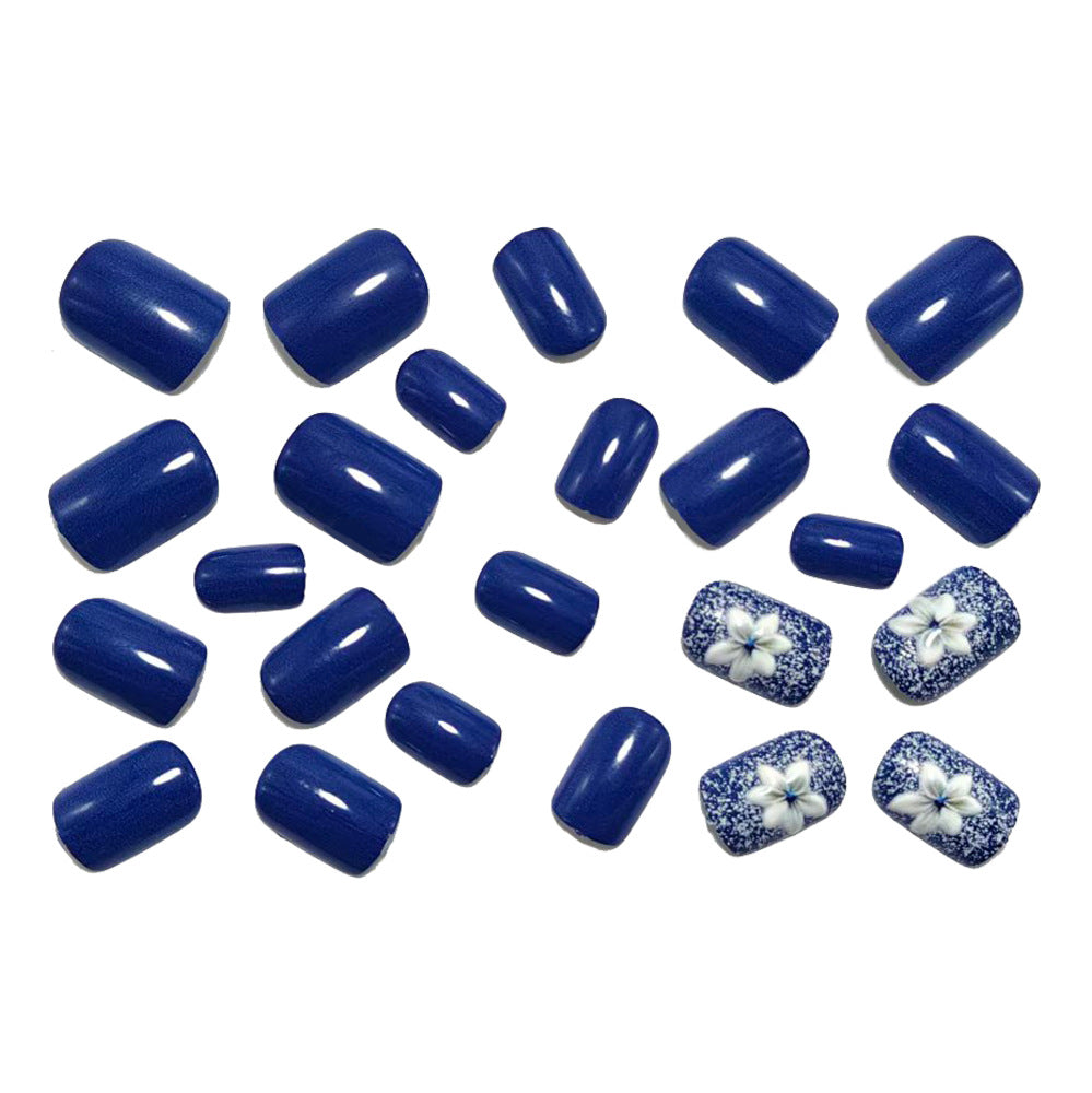 Artificial nails in elegant glitter design with floral embellishments Stornfield