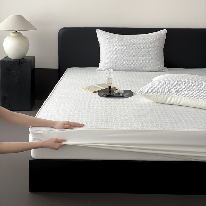 Quilted mattress protector with all-round elastic and floral relief structure