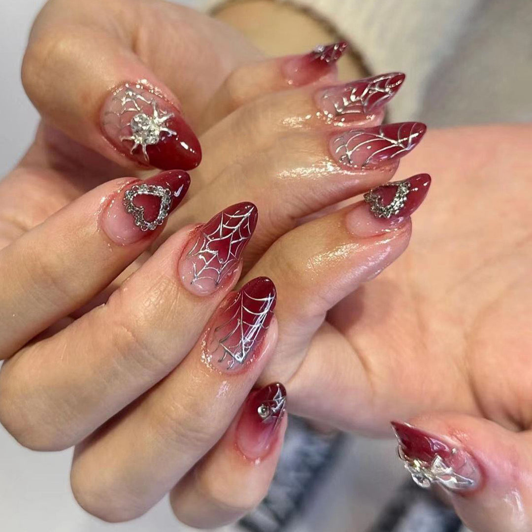 Nail art set with filigree spider web design and glitter accents Stornfield