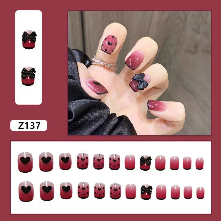 Themed Press-On Nail Set with Decorative Heart and Bow Designs