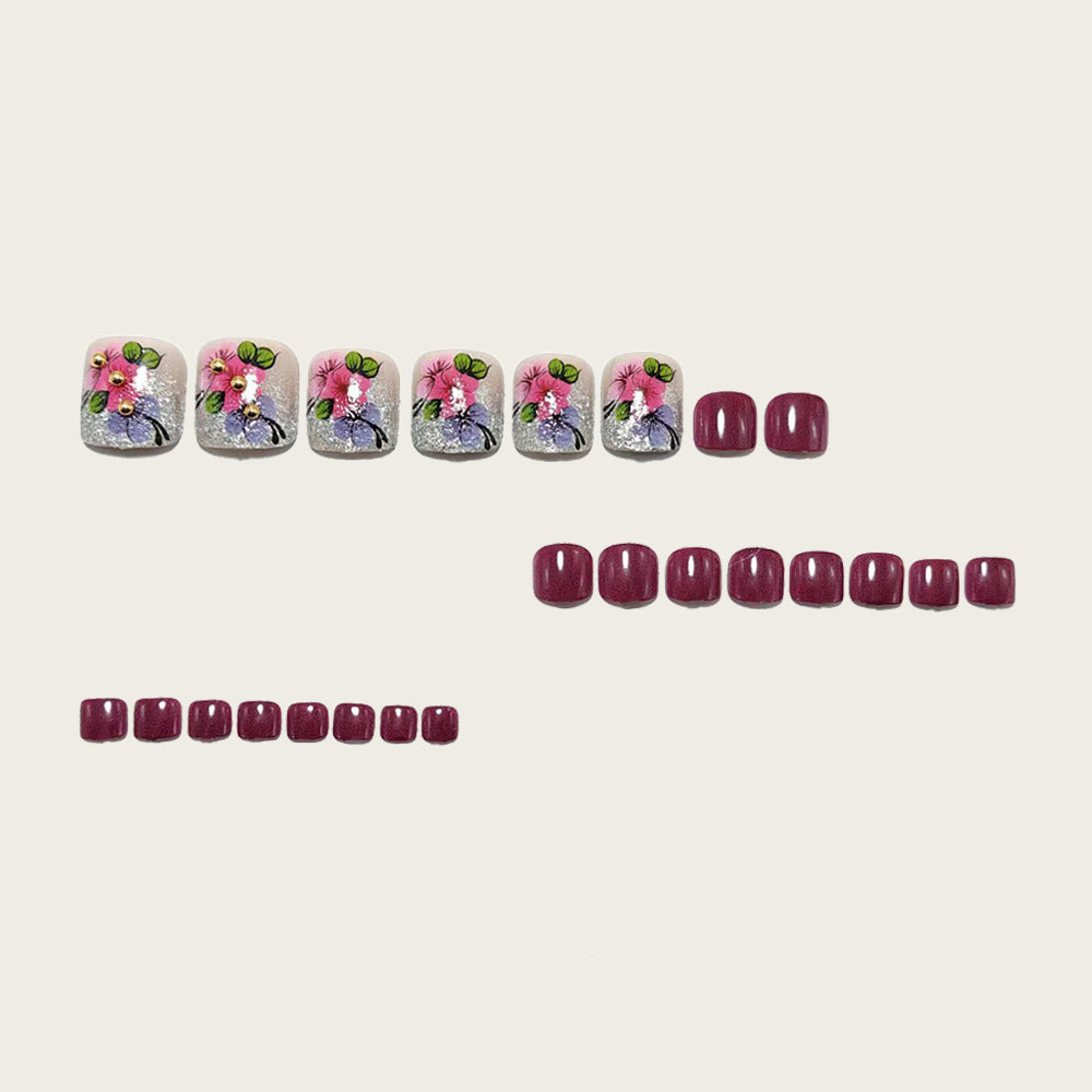 Artificial nails with floral designs and glitter effects Stornfield