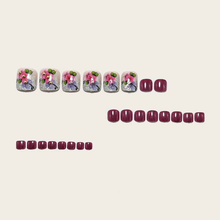 Artificial nails with floral designs and glitter effects Stornfield