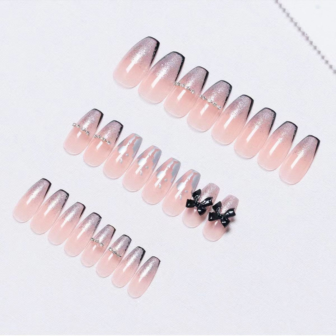 Glittering artificial nails with bow design