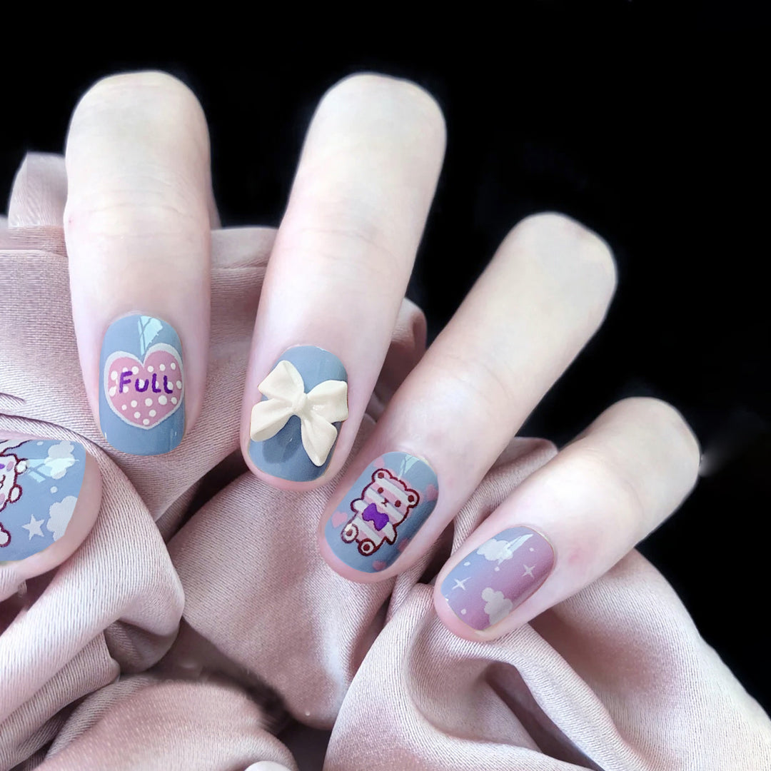 Creative nail art with bow and animal motifs Stornfield