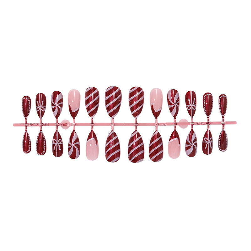 artfully designed nail set with festive candy cane motifs Stornfield