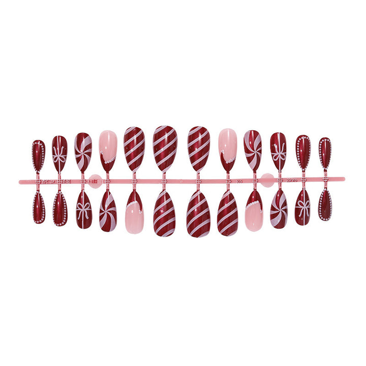 artfully designed nail set with festive candy cane motifs Stornfield