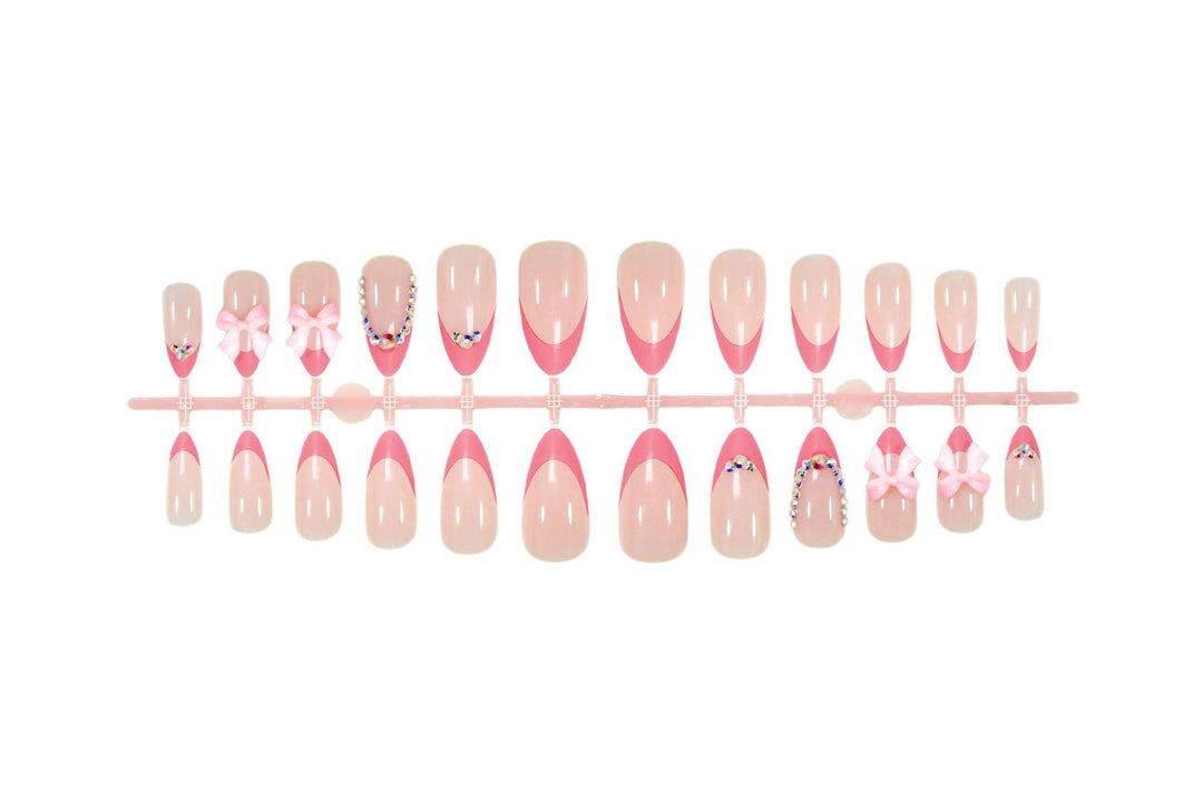 Artificial nail set with playful floral decorations and elegant glitter accents Stornfield