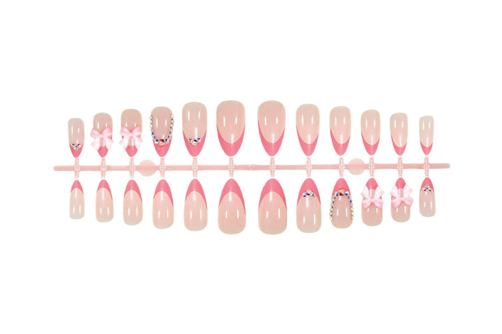 Artificial nail set with playful floral decorations and elegant glitter accents Stornfield