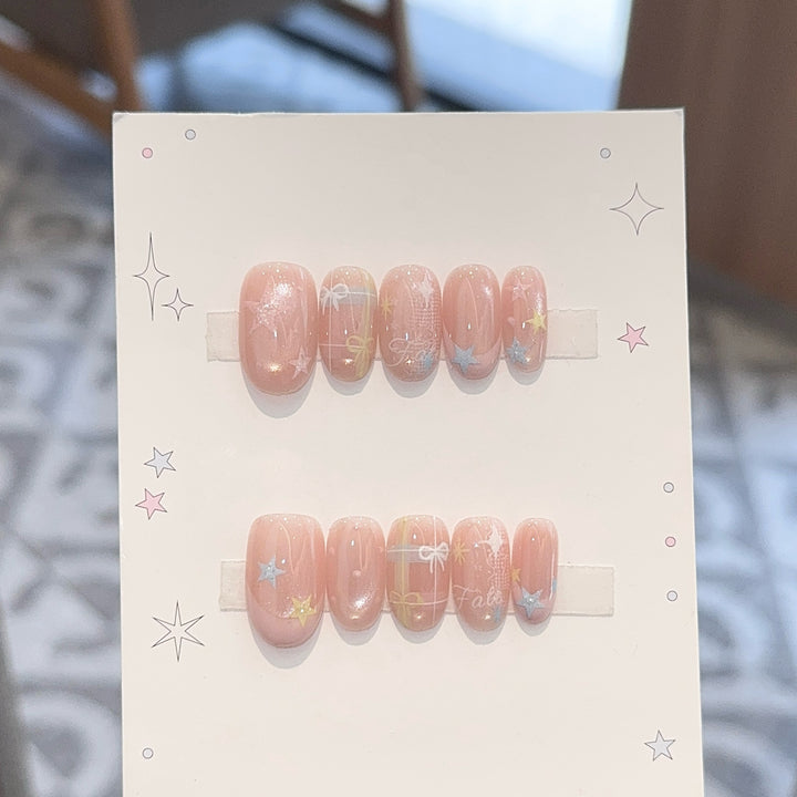 Artificial nails with romantic star and glitter motifs Stornfield