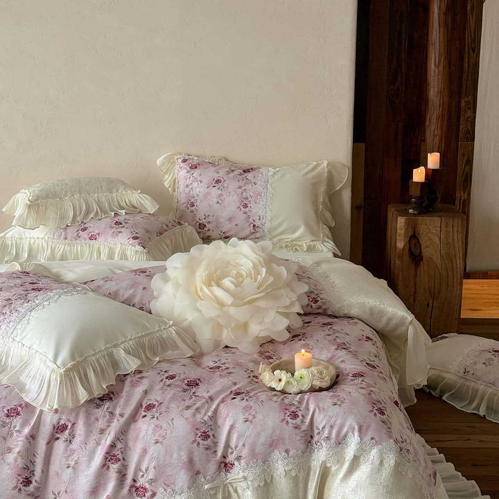 Romantic bedding and bedspread set with ruffles, lace trim, and floral quilting