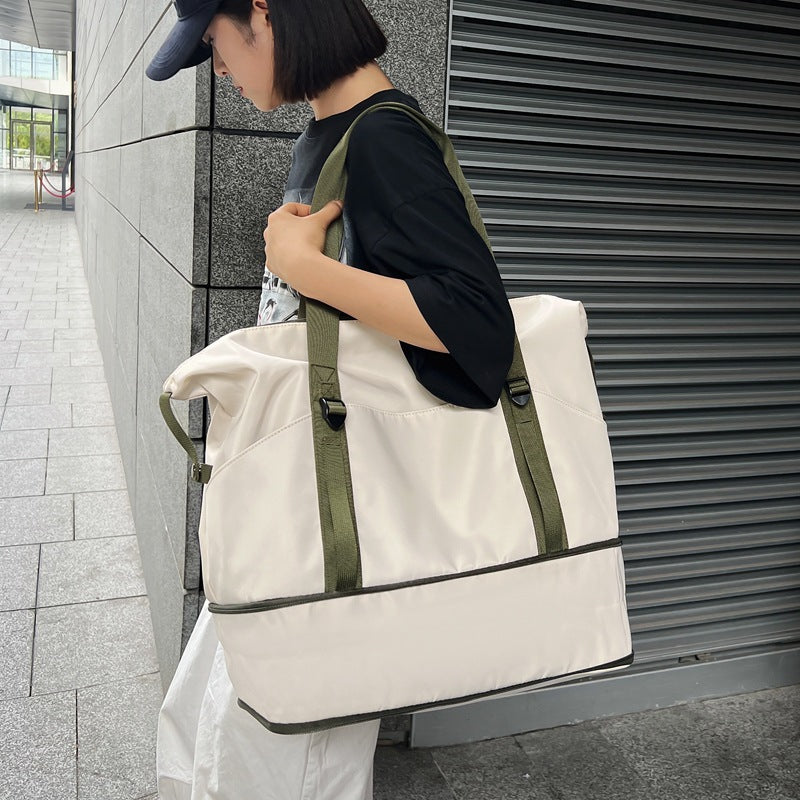 Sporty shoulder bag with water-repellent material and sturdy carrying handles Stornfield