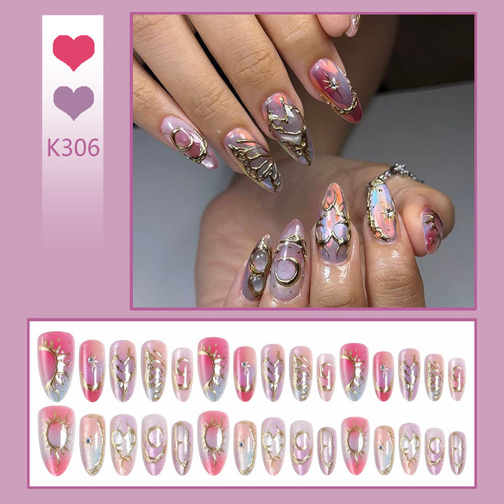 Acrylic nail set with glamorous 3D designs and elegant gold accents Stornfield