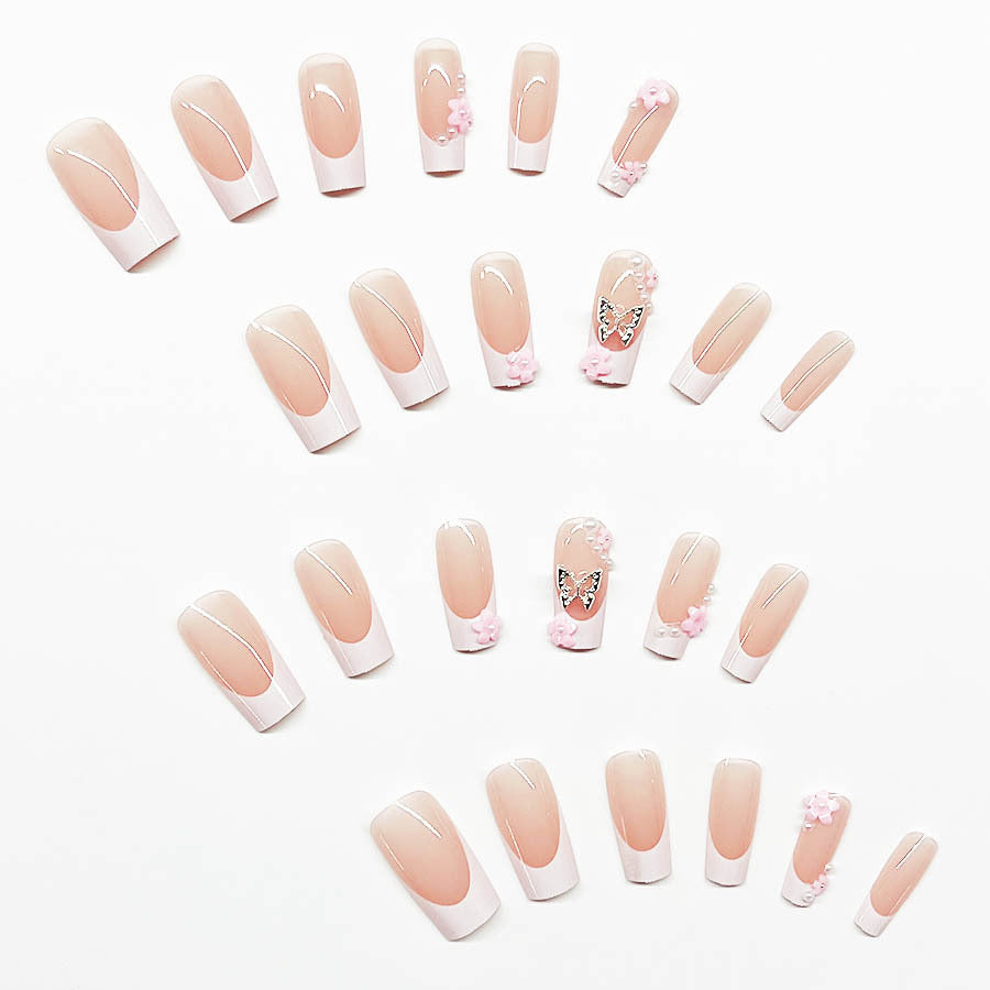 Artificial nail set with playful 3D flowers and glitter accents Stornfield