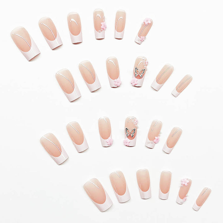 Artificial nail set with playful 3D flowers and glitter accents Stornfield