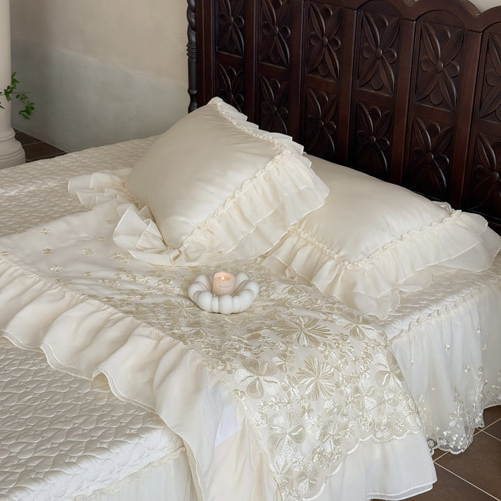 Elegant satin bedding set with double-layer chiffon ruffle and floral relief embroidery