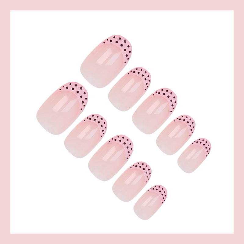 Artificial nail set with elegant tips and playful dots Stornfield