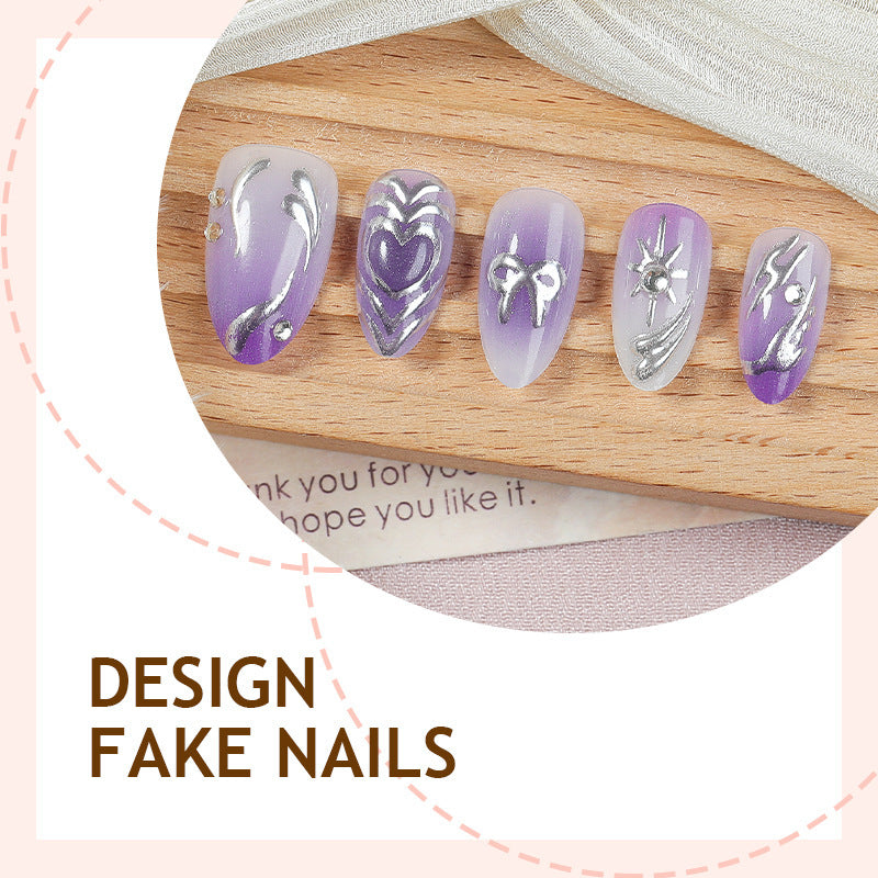 Acrylic nail set with elegant ombre design and delicate embellishments Stornfield