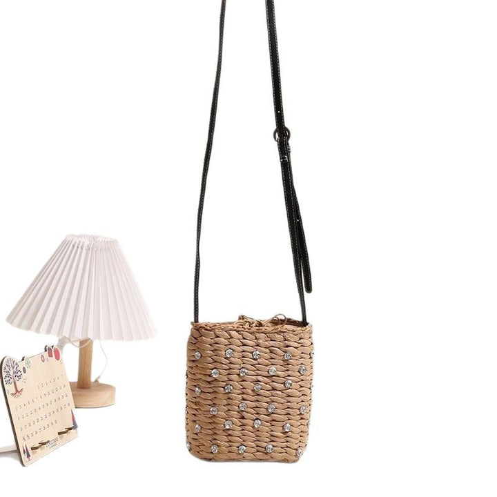 Bag made of woven natural material with sparkling appliqués Stornfield