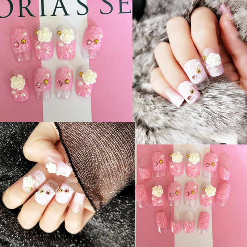 Artificials nails with sparkling rhinestone accents and elegant flower embellishments Stornfield